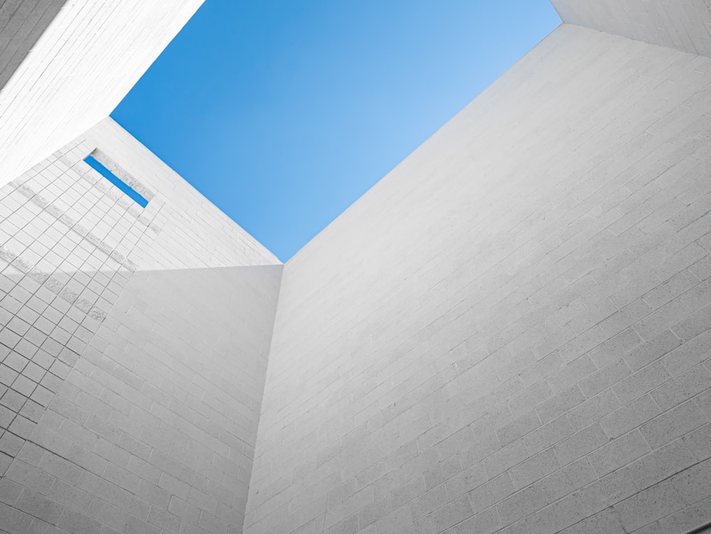 a white building with a blue sky in the background