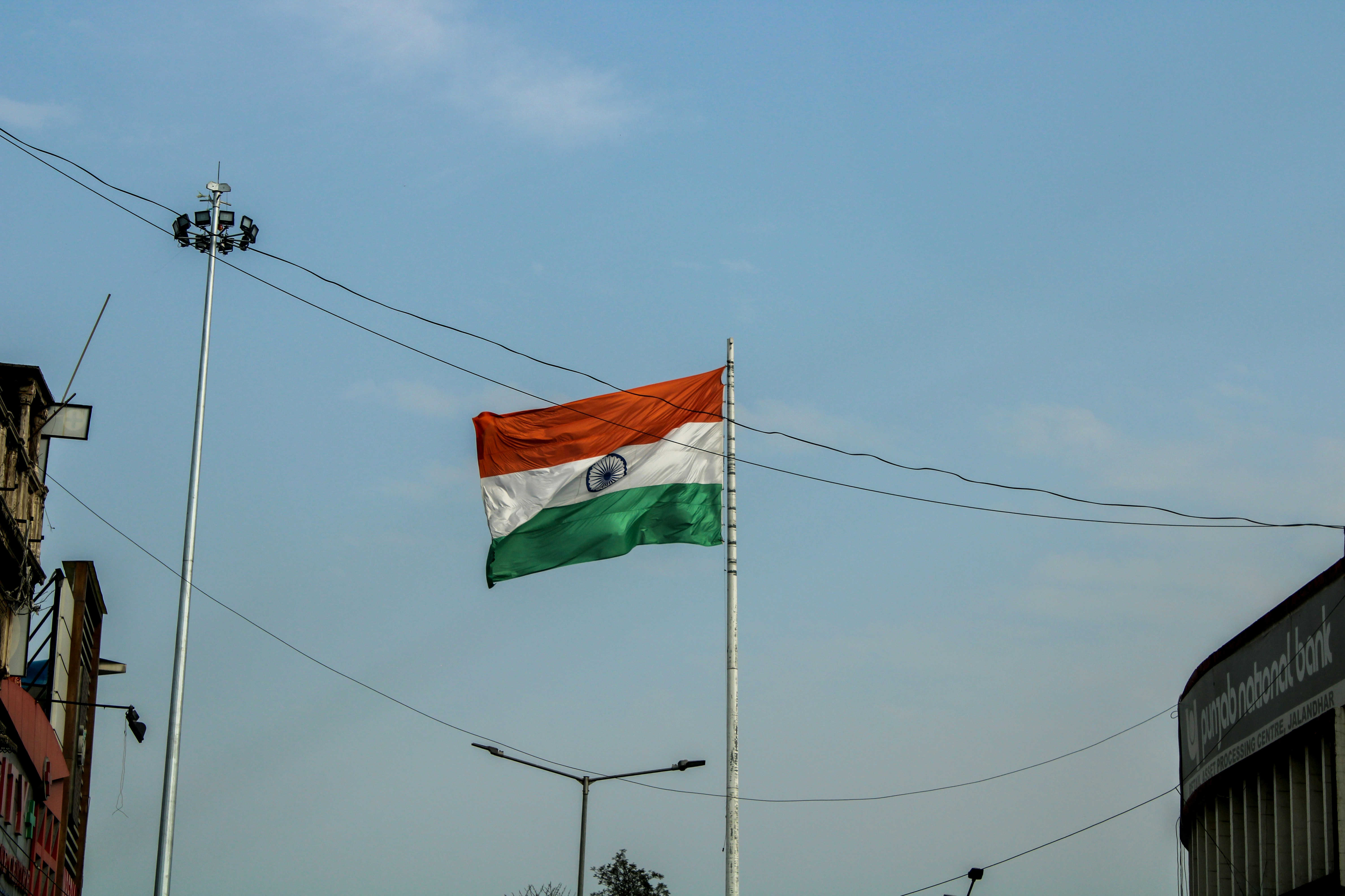 the indian flag is flying high in the sky