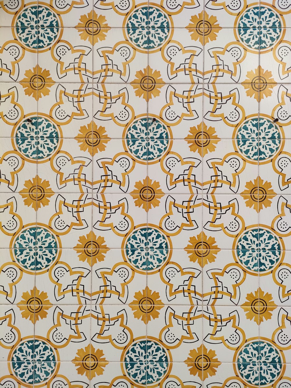 a tiled wall with a pattern on it