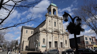 a large church with a steeple and a clock tower