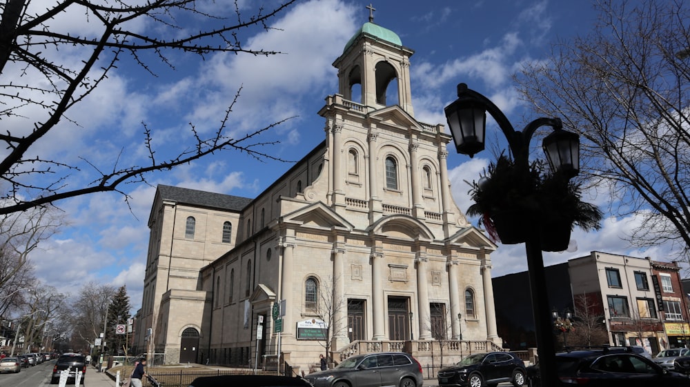 a large church with a steeple and a clock tower