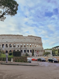 a large building with a lot of cars parked in front of it