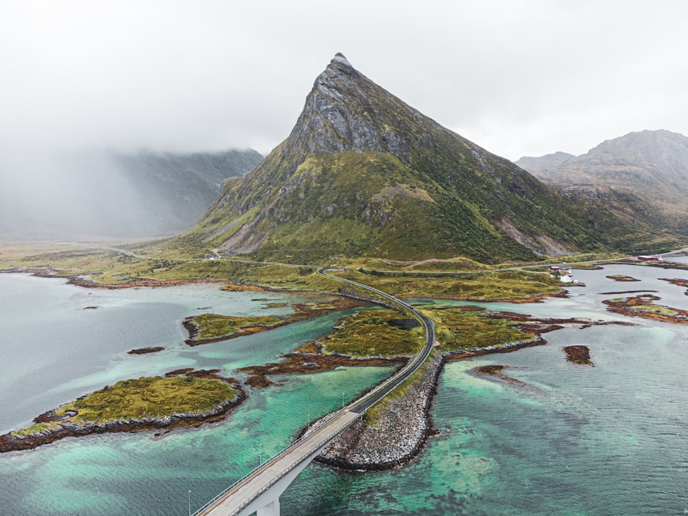 an aerial view of a bridge over a body of water