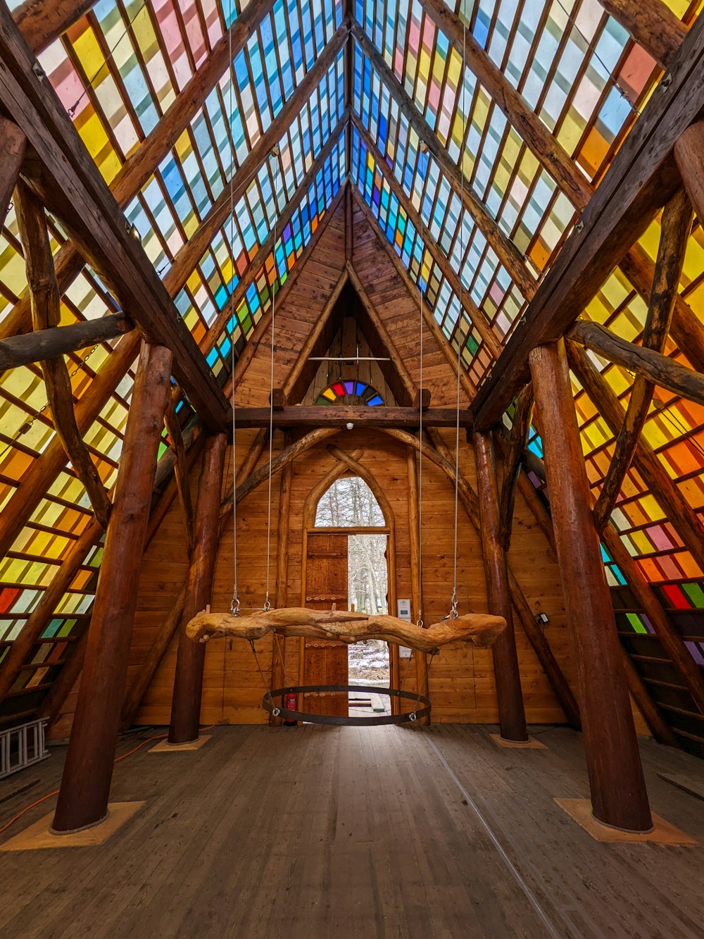 a large wooden building with stained glass windows