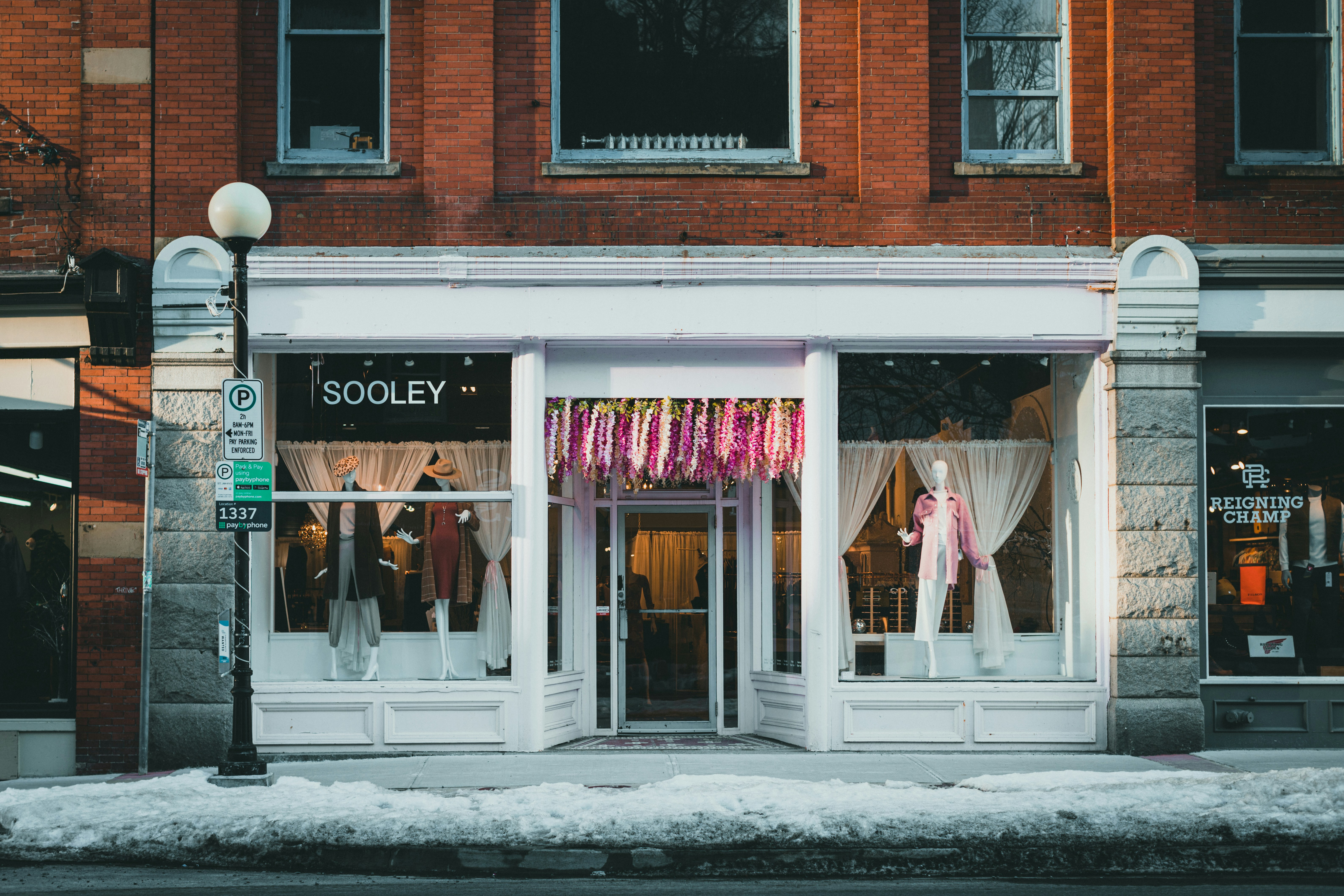a street corner with a store front and store windows