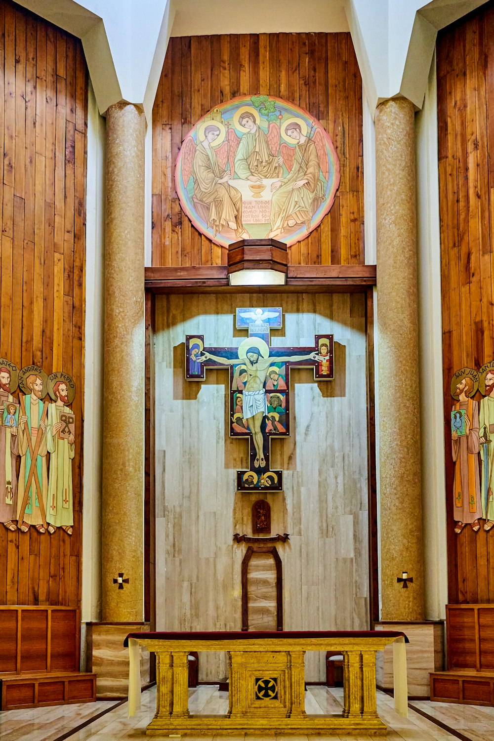 a wooden alter with a cross on it in a church