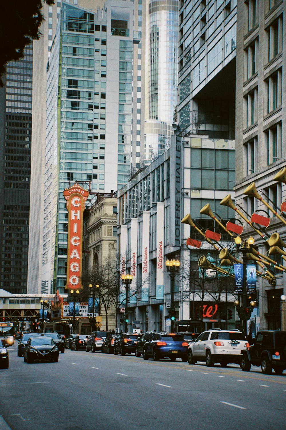 a city street filled with lots of tall buildings