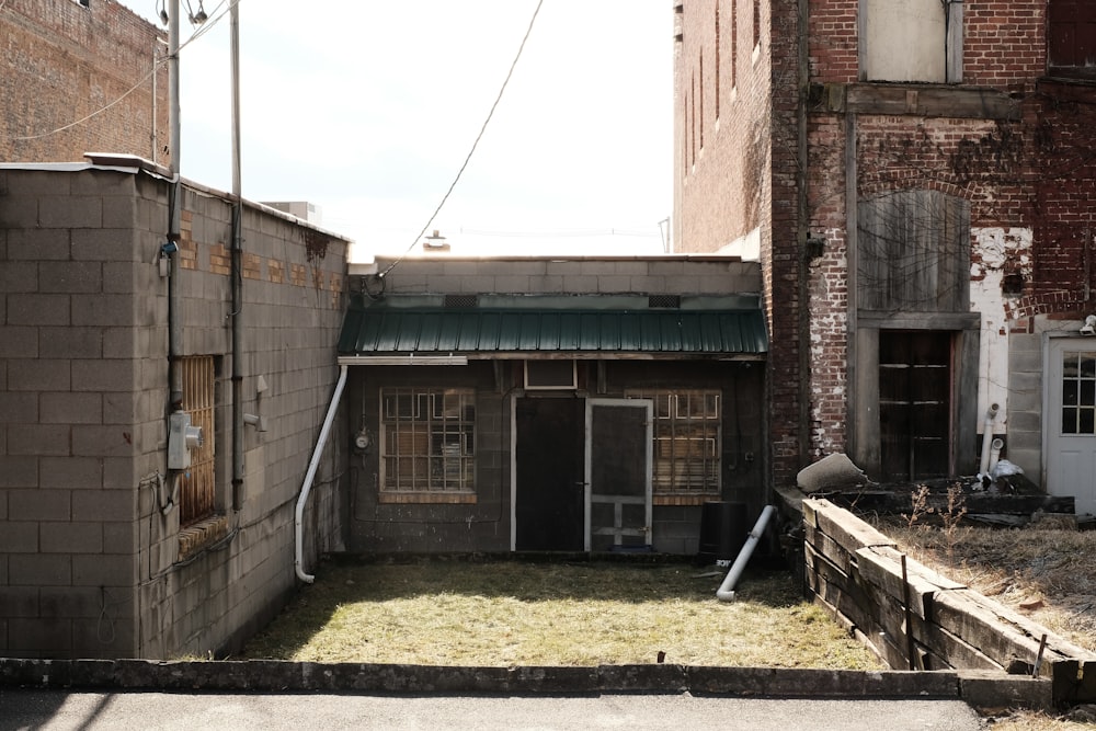 a small building with a green roof and a green roof