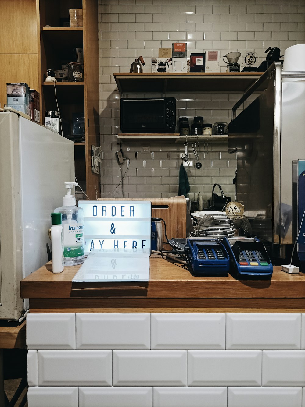 a white refrigerator freezer sitting on top of a wooden counter