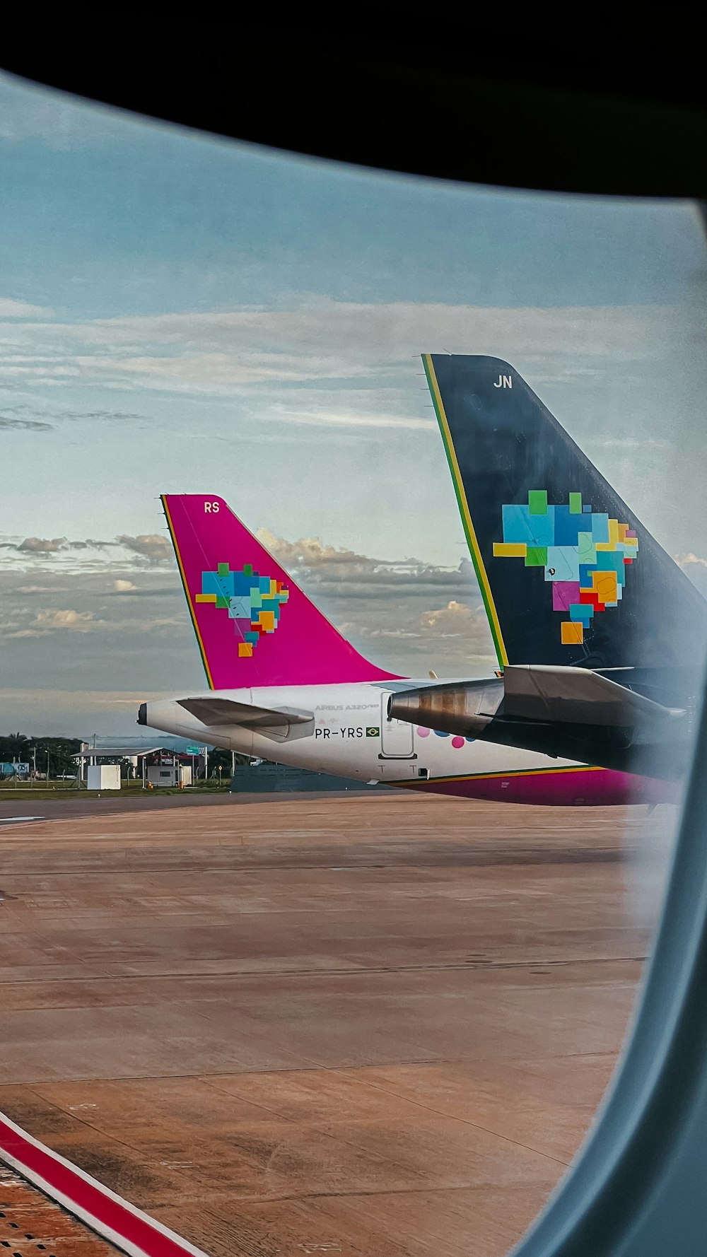 a couple of airplanes that are sitting on a runway