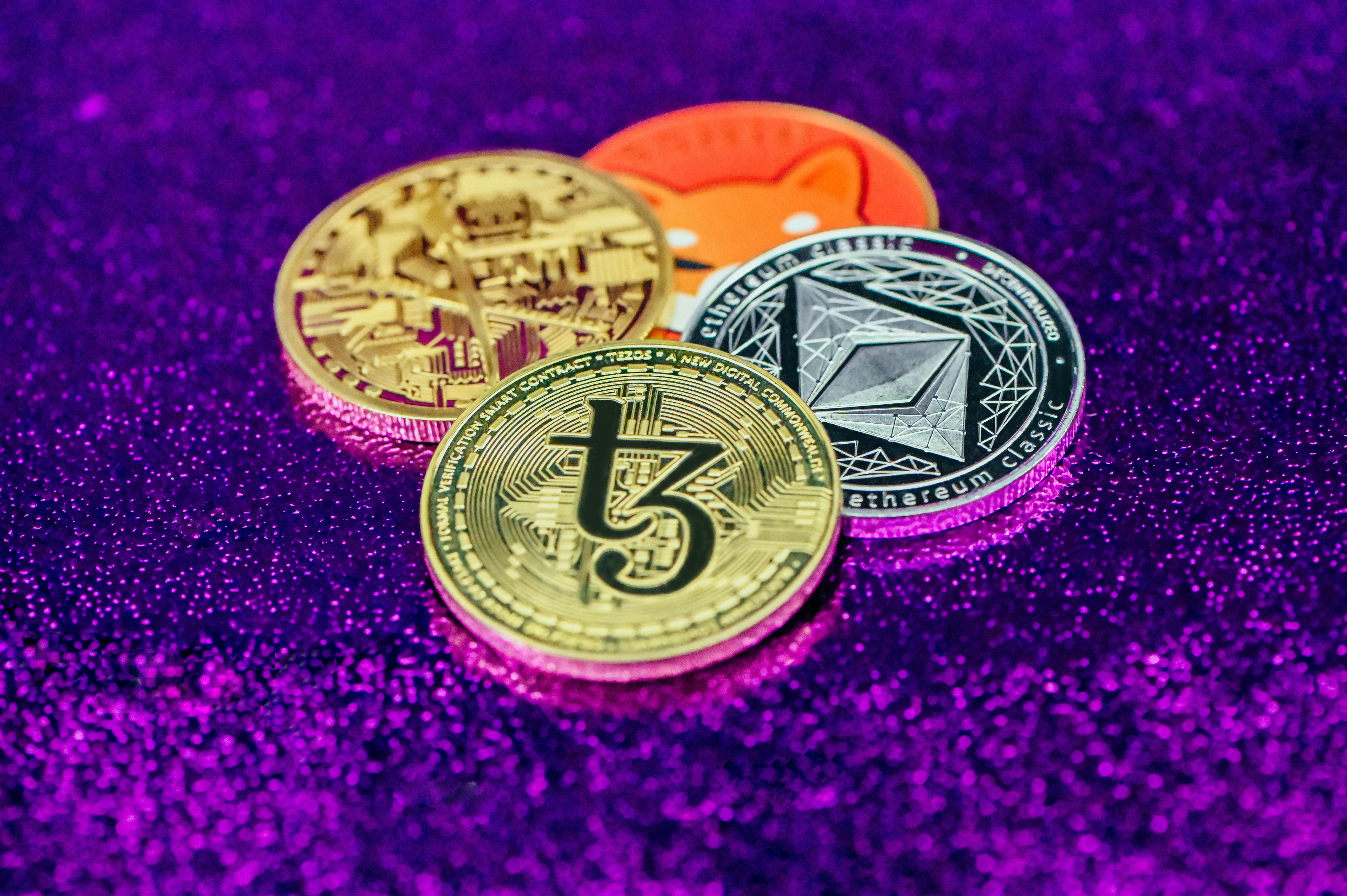 Variety coins on the sparkling purple fabric