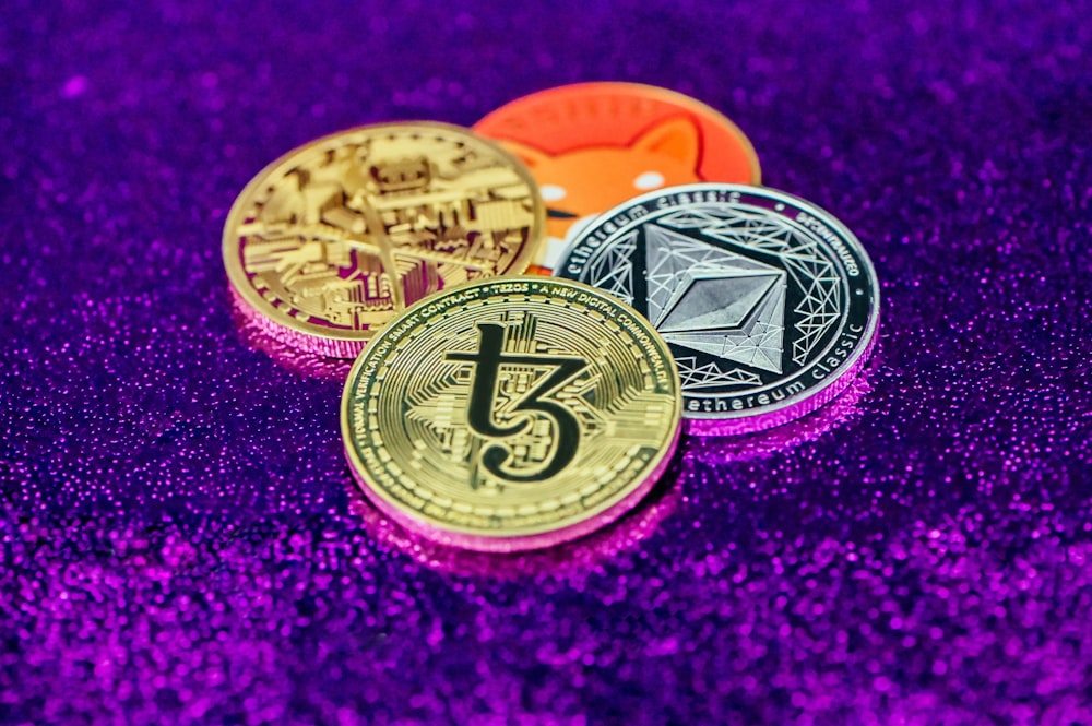 three different types of bitcoins on a purple background
