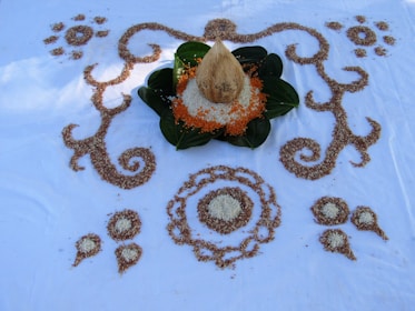Fresh pandan leaves arranged artistically on natural wooden surface.