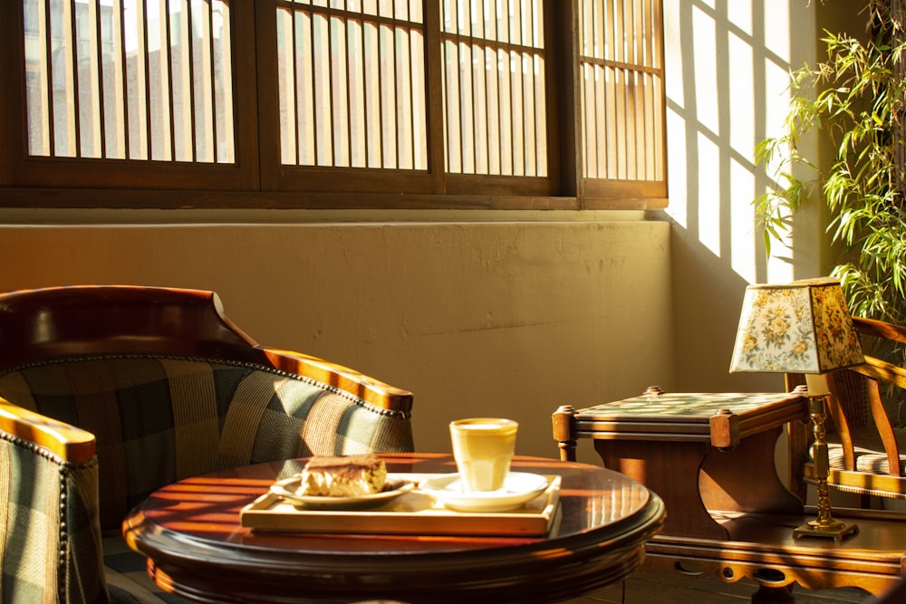 a table with a tray of food and a cup of coffee on it