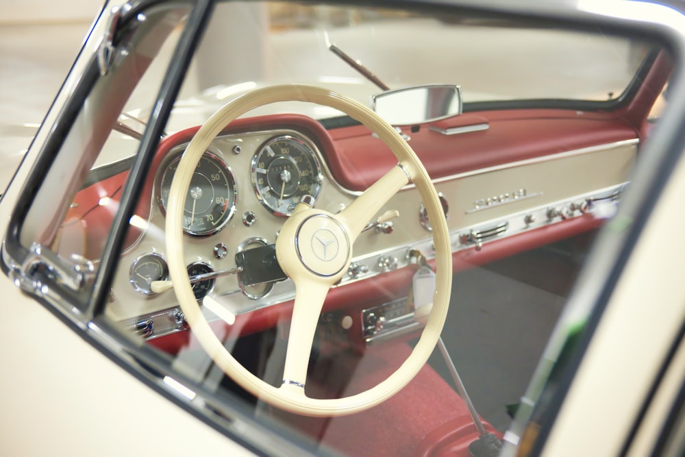 the interior of a car with a steering wheel and dashboard