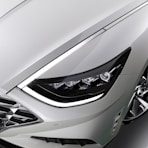 a close up of the front lights of a car