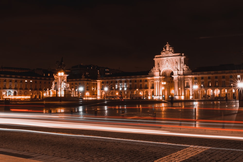 a large building with a clock tower at night