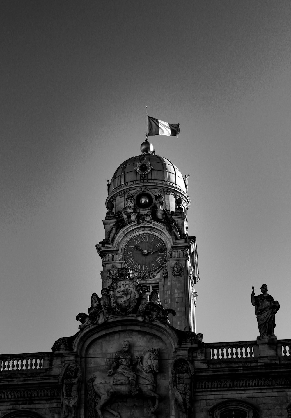 a black and white photo of a clock tower