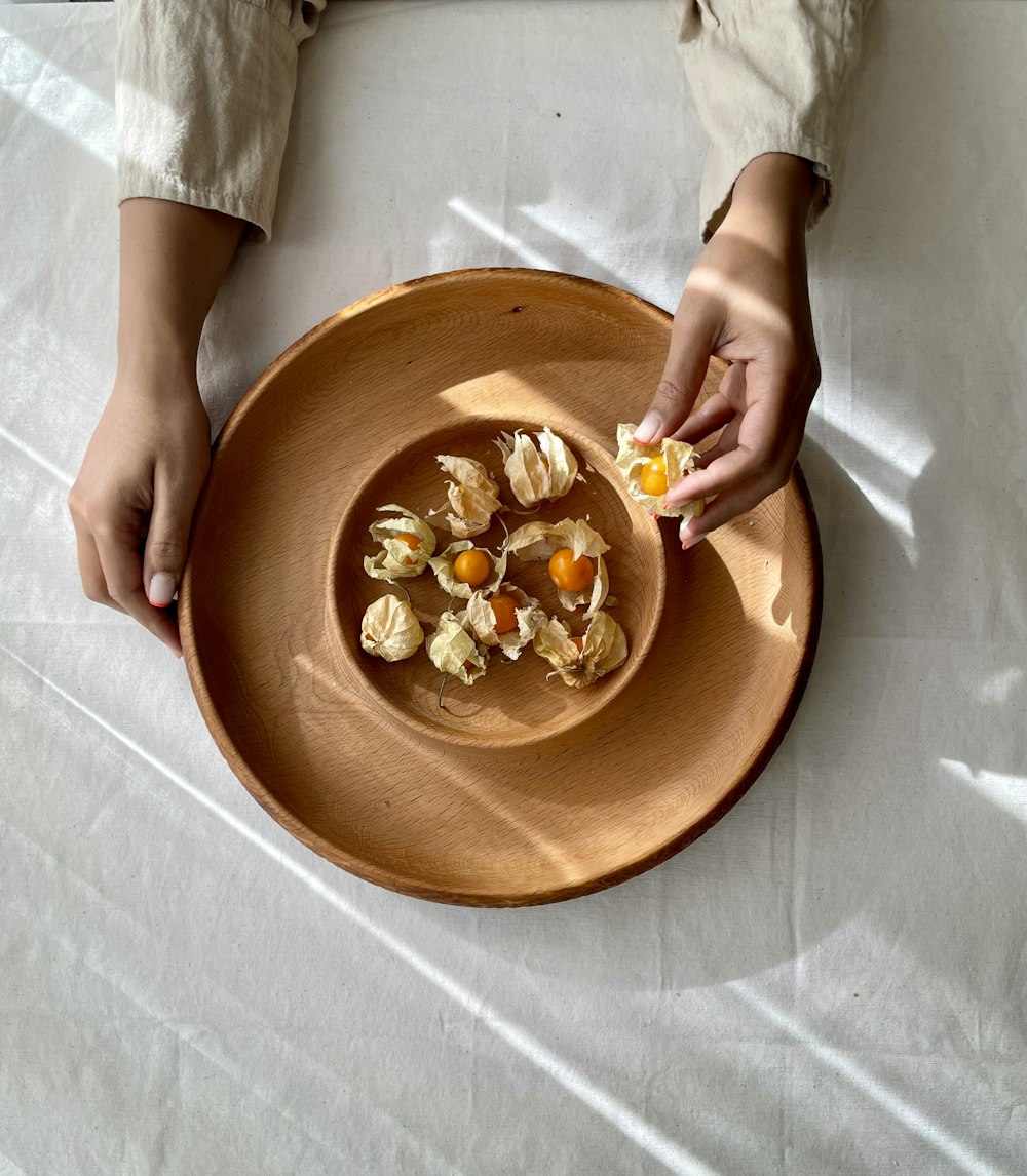 a person sitting at a table with a plate of food