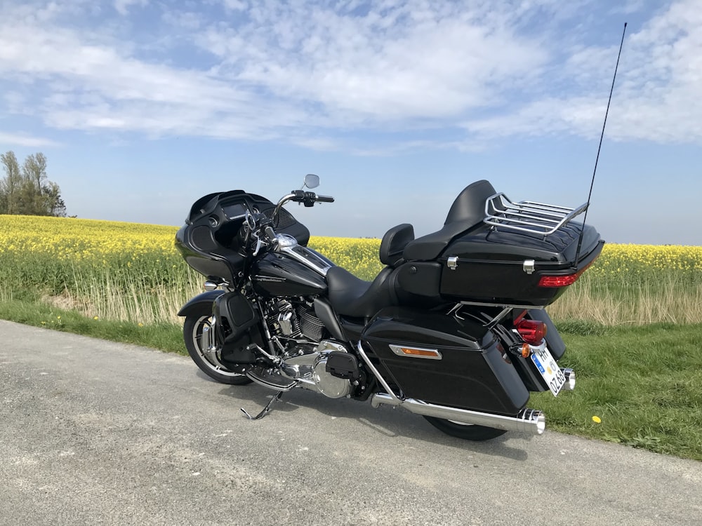 a black motorcycle parked on the side of a road