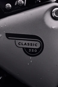 Close-up of a shiny Royal Enfield Classic 350 ready for a coastal ride.