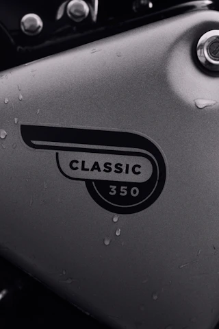 Close-up of a shiny Royal Enfield Classic 350 ready for a coastal ride.