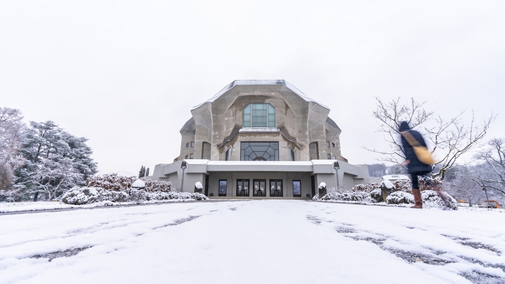 a large building with a lot of snow on the ground