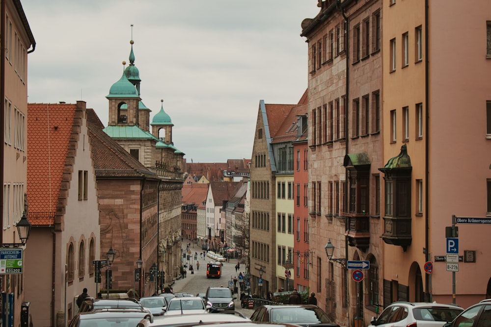 a city street with cars parked on both sides of it