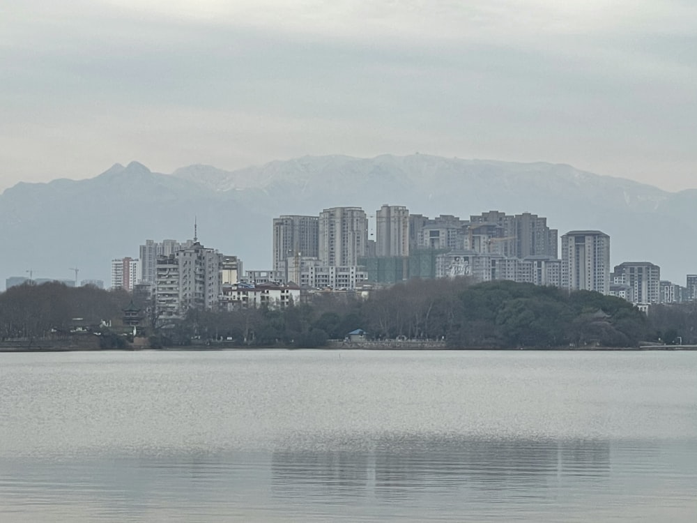 a large body of water with a city in the background