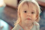 A candid shot of a child’s curious gaze, bathed in soft natural light.