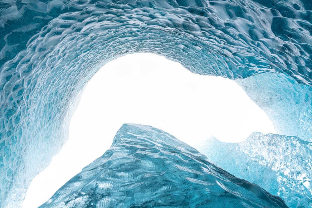 a large ice cave filled with lots of blue ice