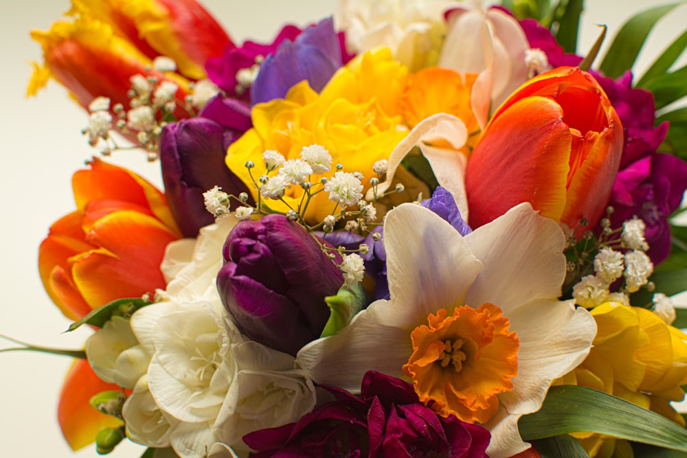 a bouquet of colorful flowers in a vase