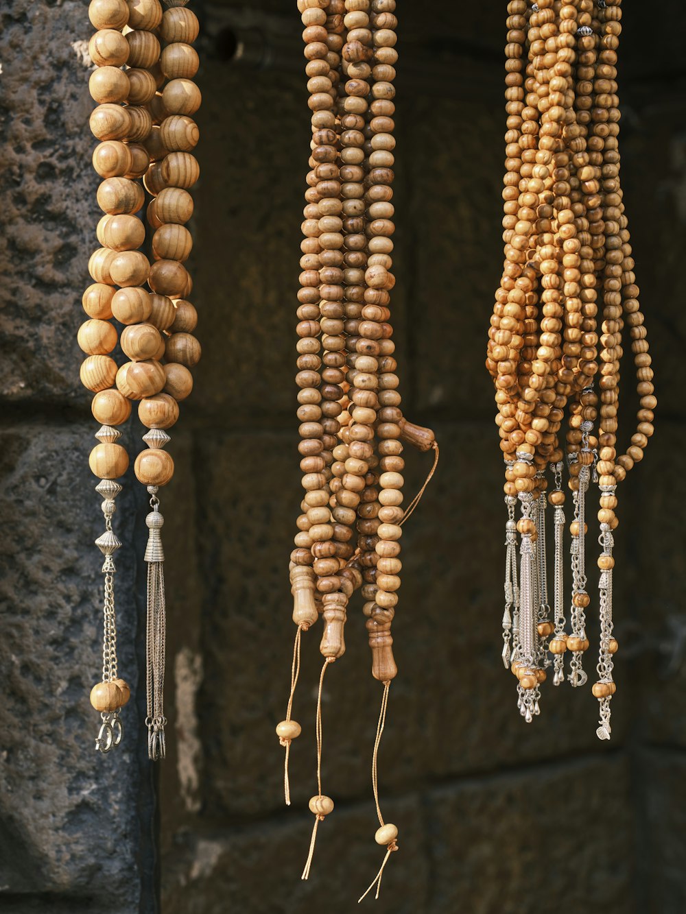 a group of wooden beads hanging from a ceiling