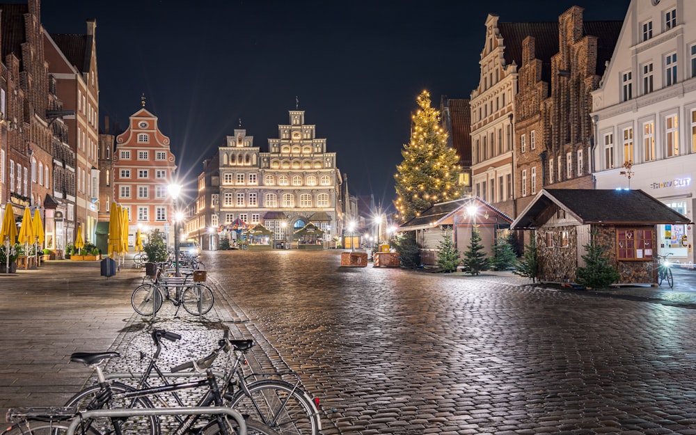 a cobblestone street lined with parked bicycles