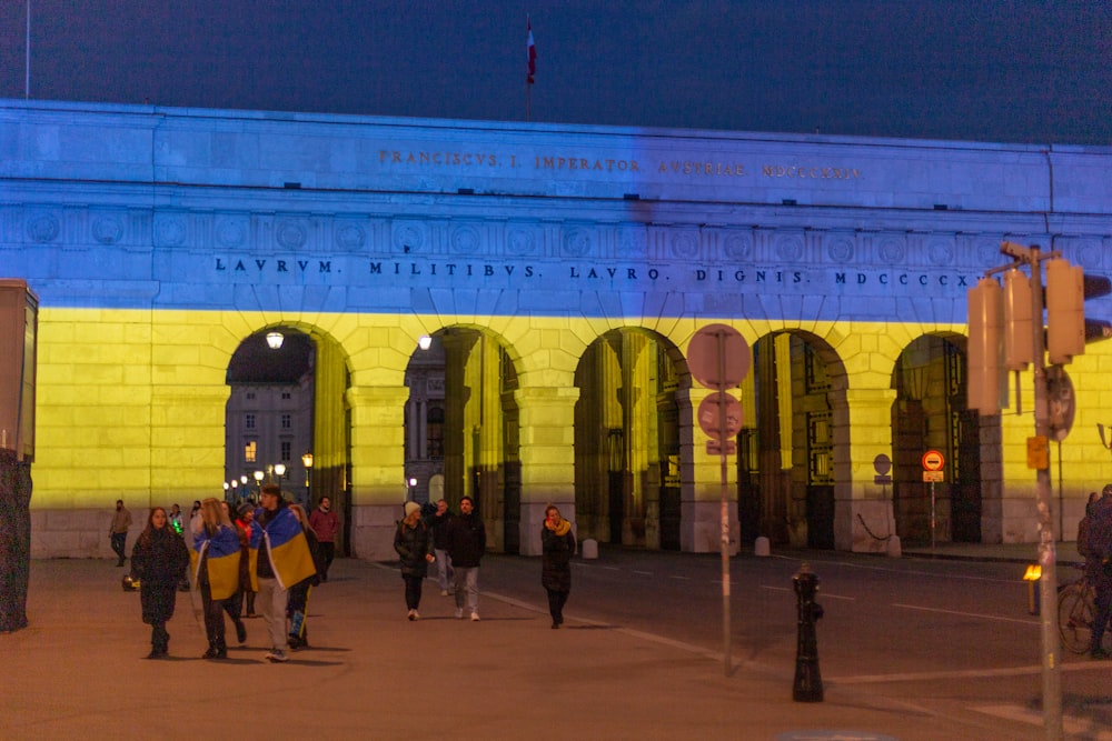 a group of people standing in front of a building