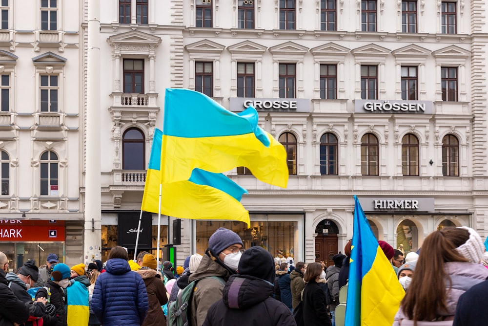 a crowd of people standing in front of a building