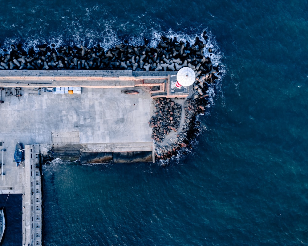 an aerial view of a pier with a bunch of birds on it