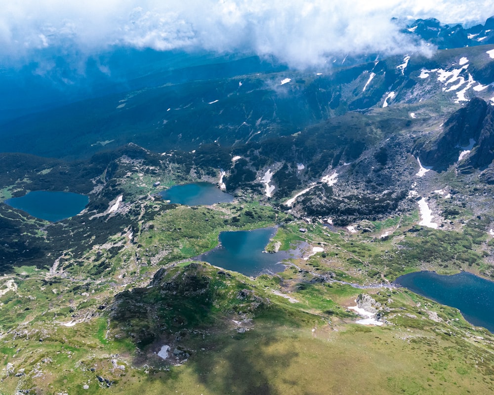 an aerial view of some mountains and lakes