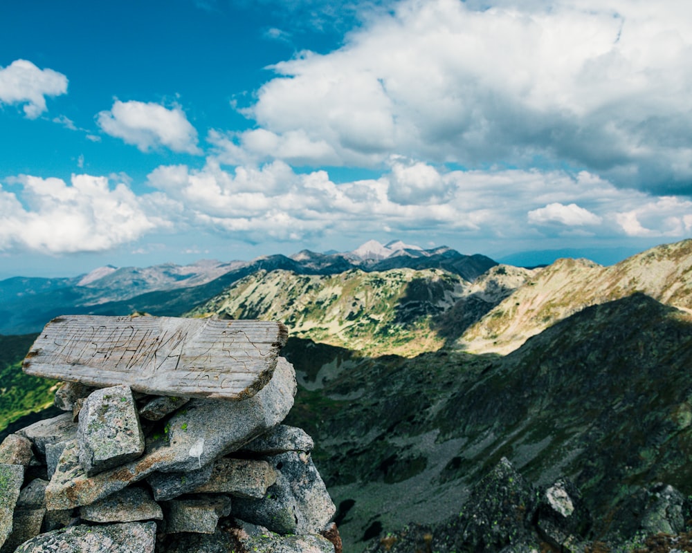 a pile of rocks on top of a mountain