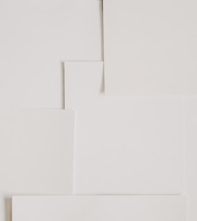 Stack of elegant printable designs with minimalist patterns and typography.