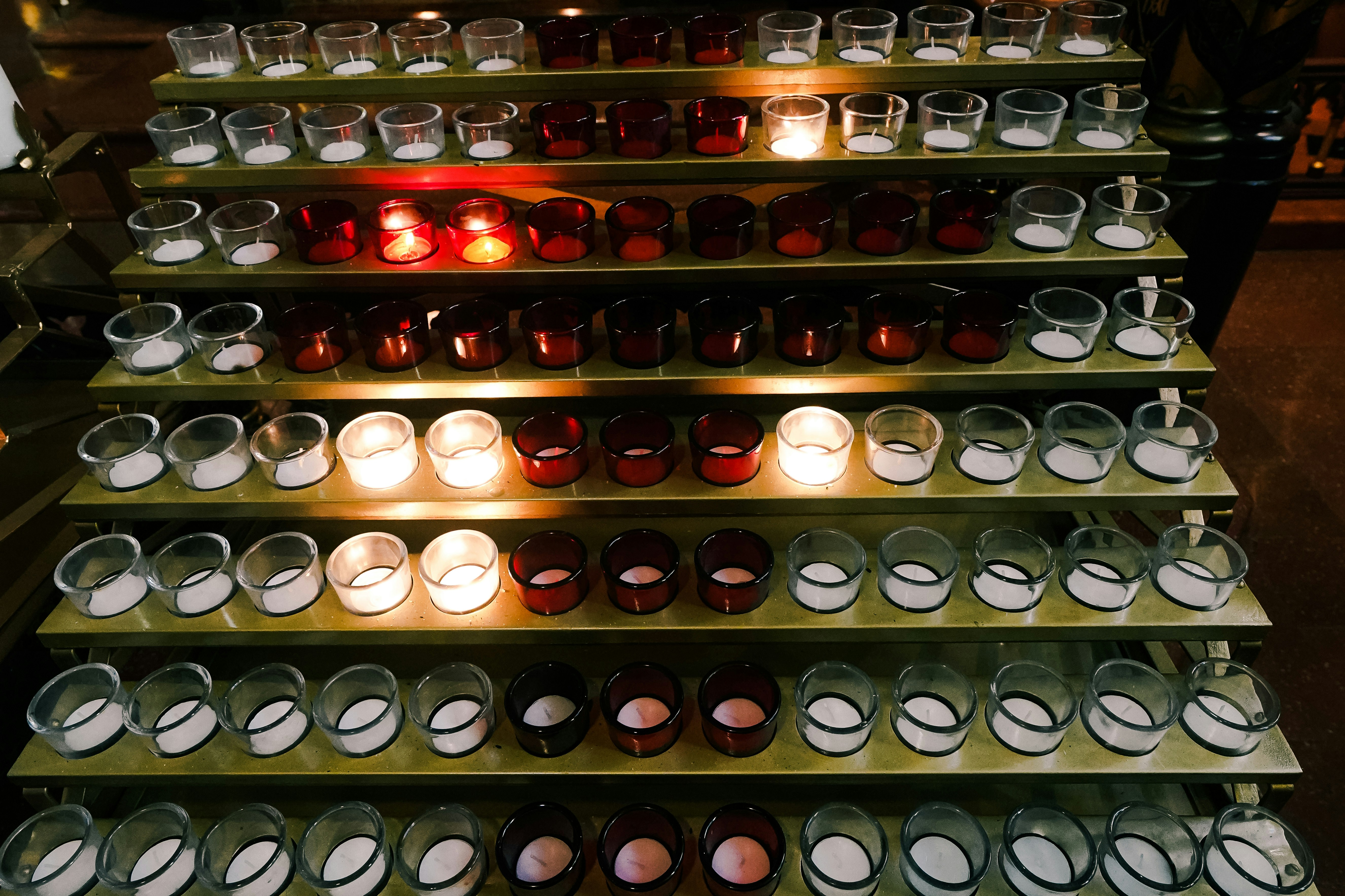 a display case filled with lots of candles
