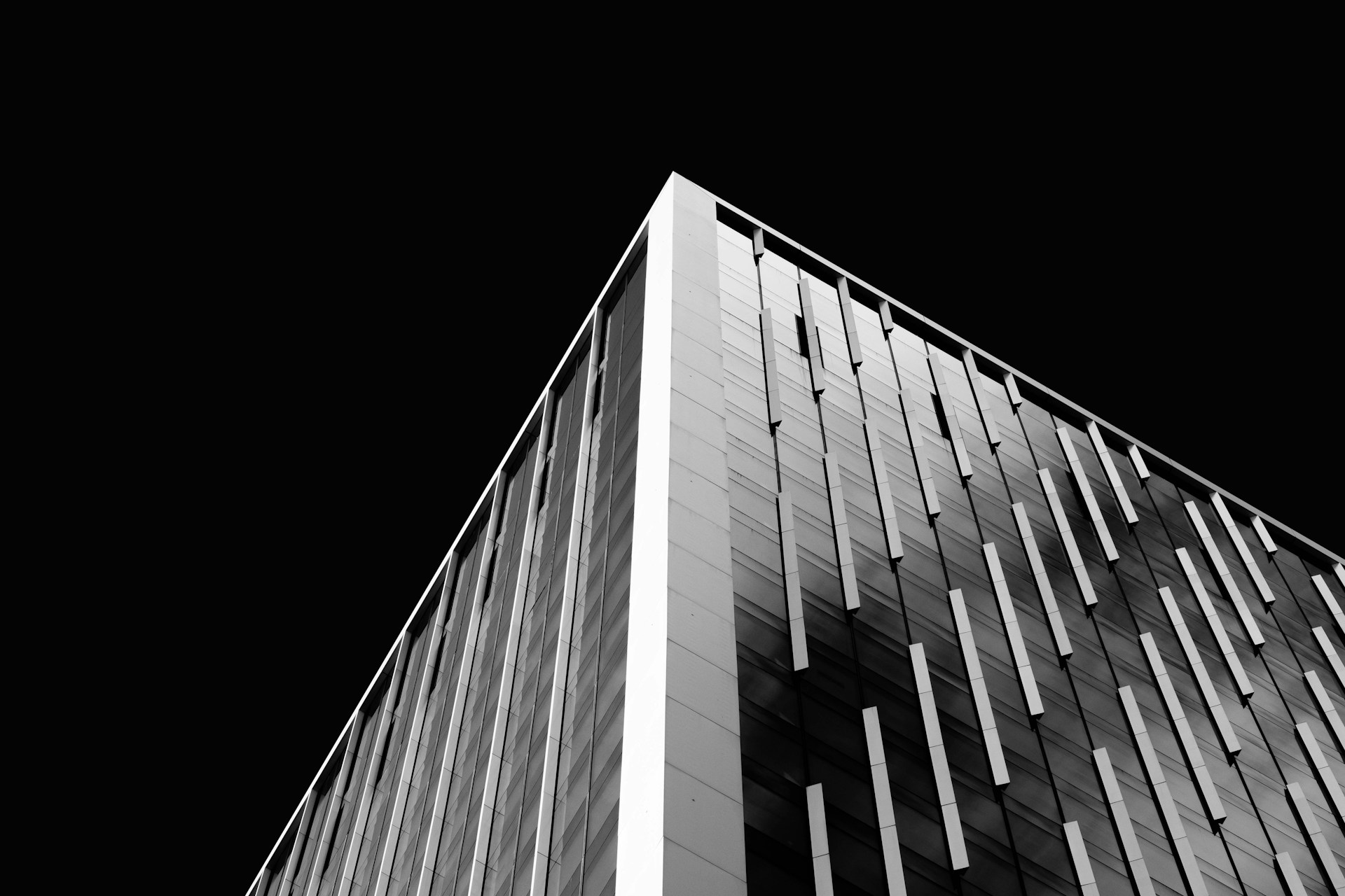 a black and white photo of a tall building