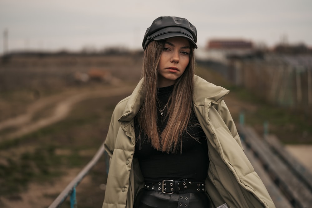 a woman wearing a hat and a jacket