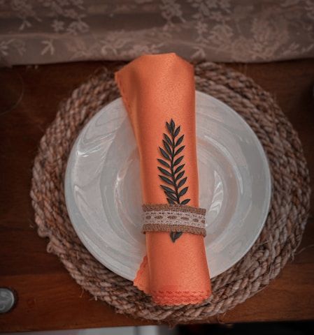 A beautifully set dining table featuring handcrafted crochet pieces.