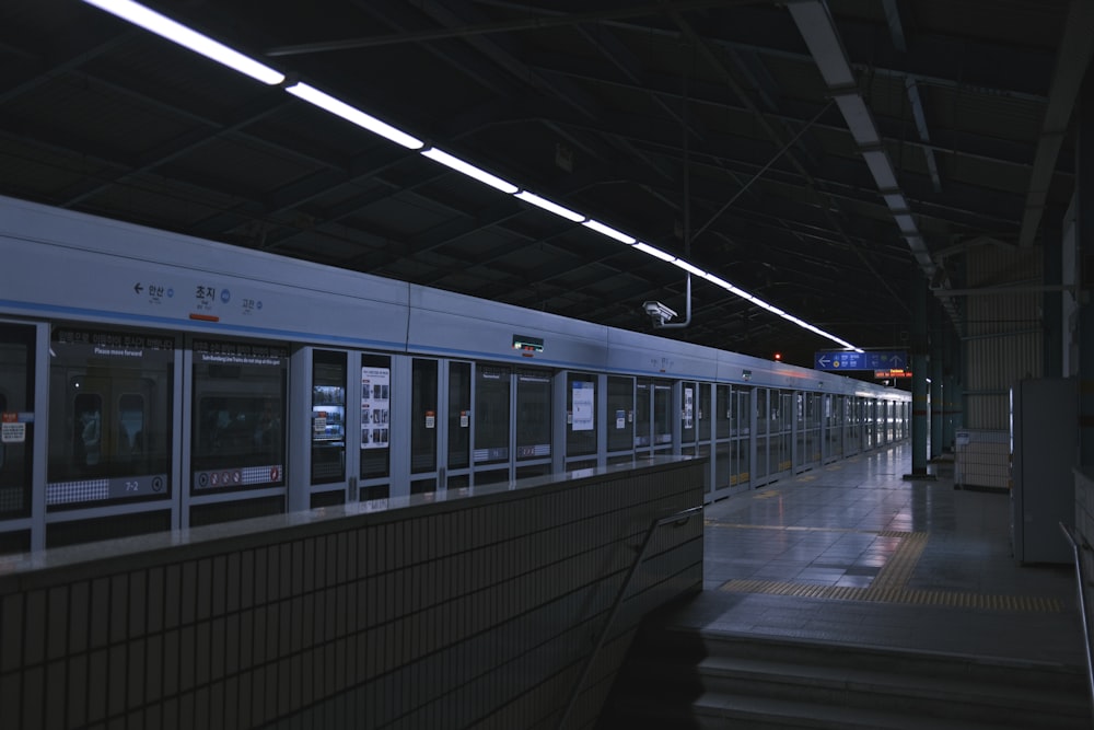 a train station with a train on the tracks