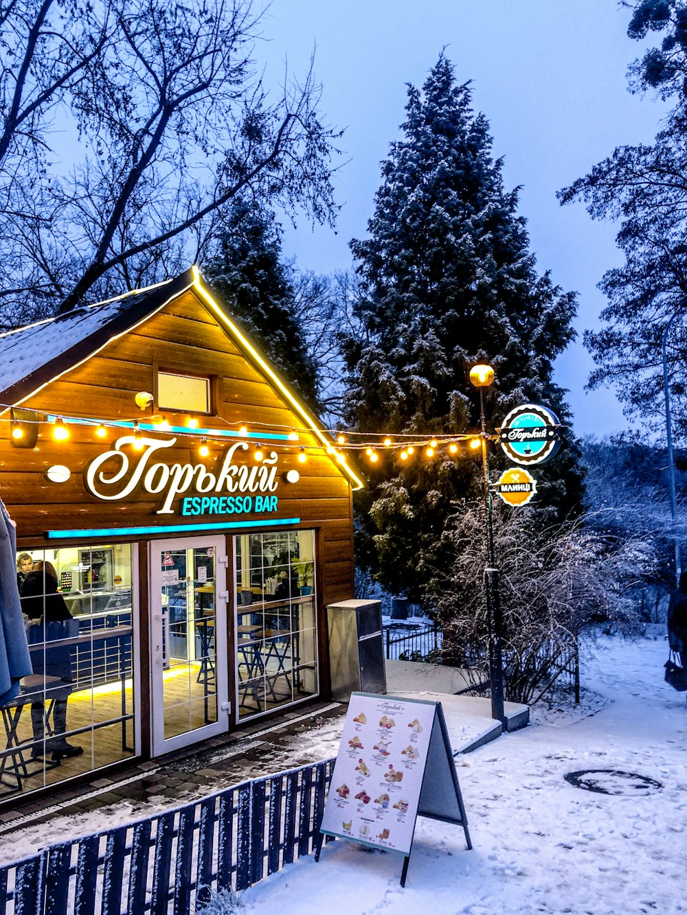 a small building with a sign in front of it