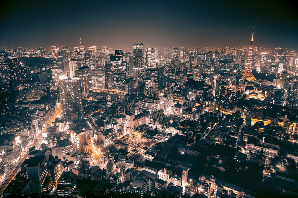 a view of a city at night from the top of a building