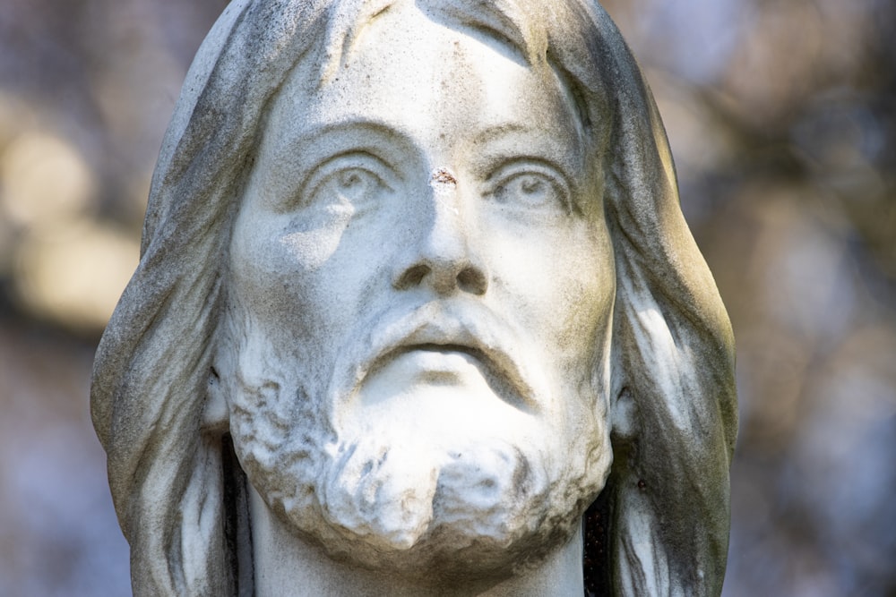 a close up of a statue of jesus