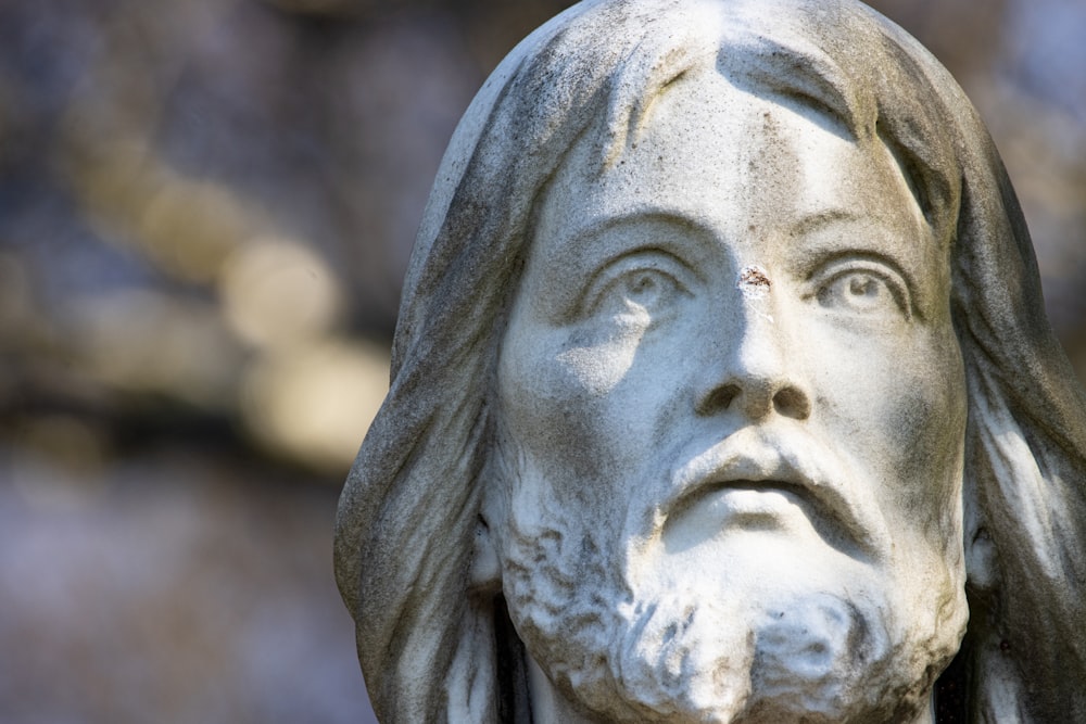 a close up of a statue of jesus