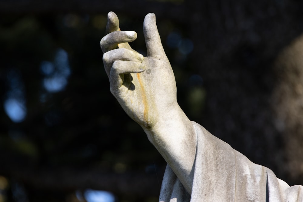 a statue of a hand making a peace sign